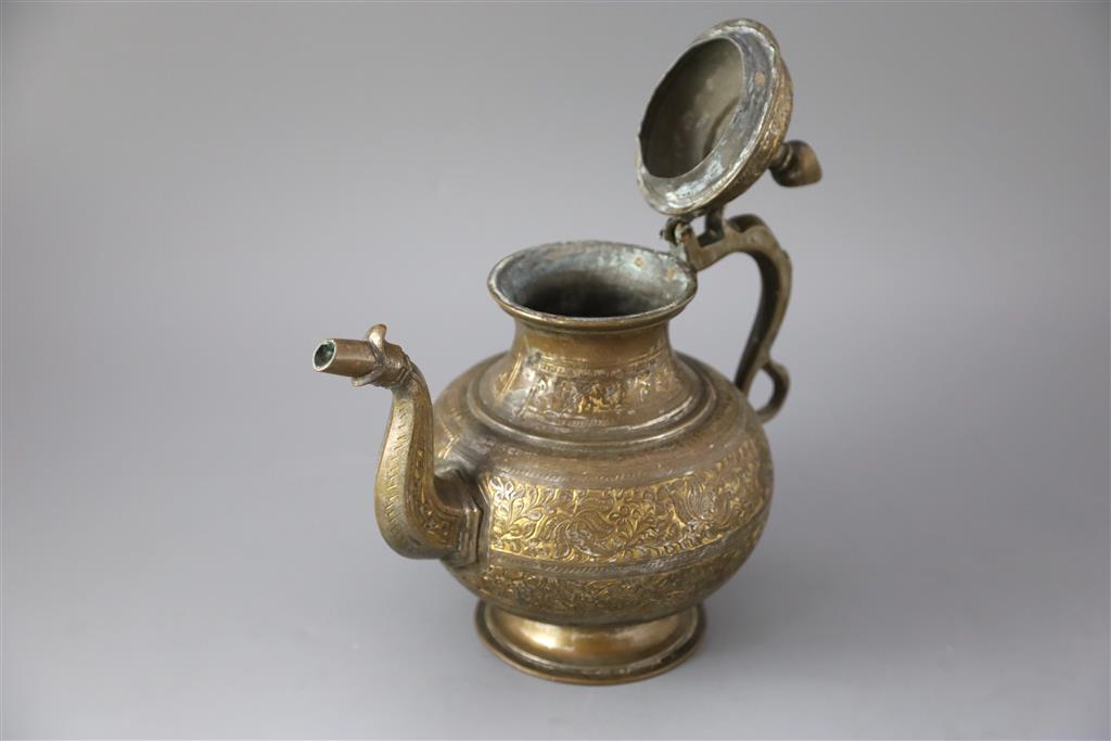 An 18th century Mughal Indian bronze and parcel gilt ewer, 26cm high